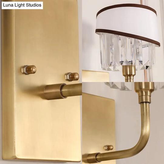 Contemporary Brass Cylinder Sconce With Crystal And Curved Arm Wall Mount Light