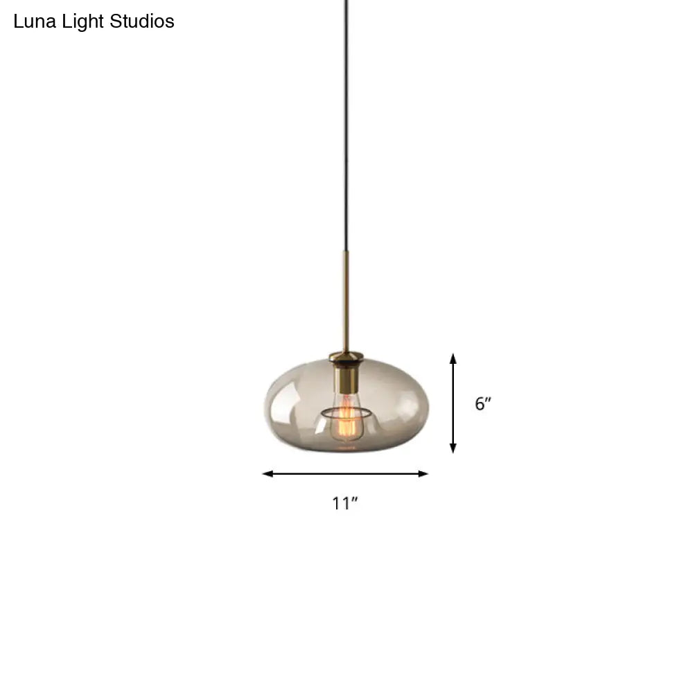 Contemporary Brass Pendant Light With Clear Glass Shade - Oval/Drum/Cylinder 1-Light 7/10/11 Wide