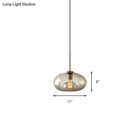 Contemporary Brass Pendant Light With Clear Glass Shade - Oval/Drum/Cylinder 1-Light 7/10/11 Wide