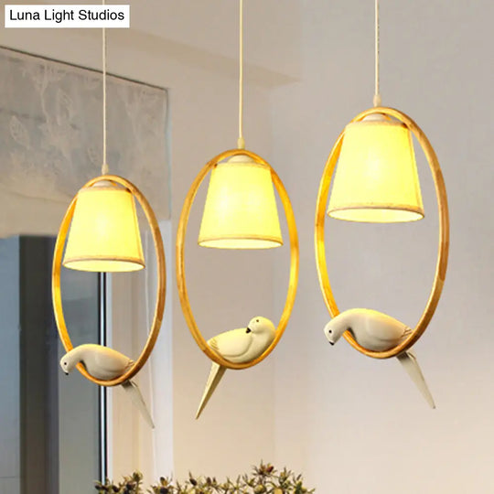 Contemporary Cone Pendant Light Fixture With Hanging Fabric Wood Ring And Resin Bird - 1/3 Lights