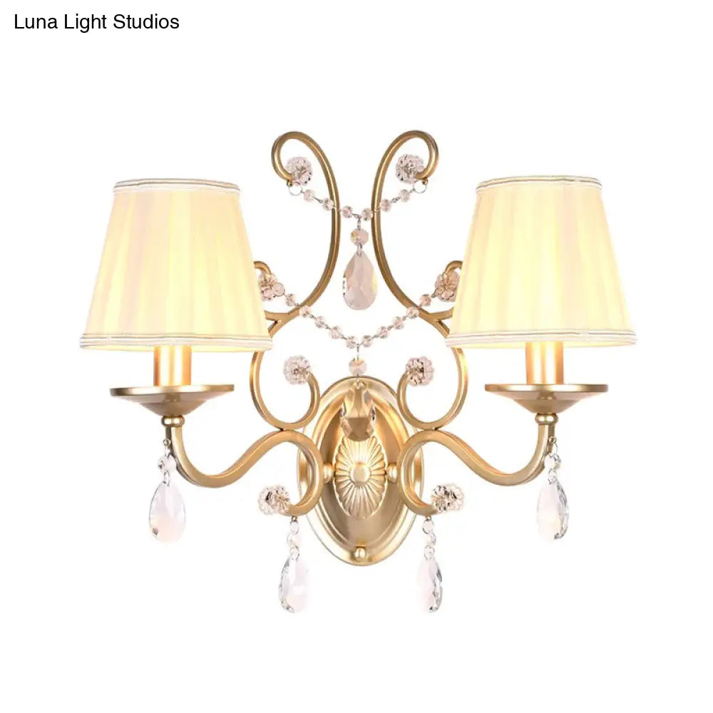 Contemporary Crystal Wall Sconce With Curved Arm And Brass Finish