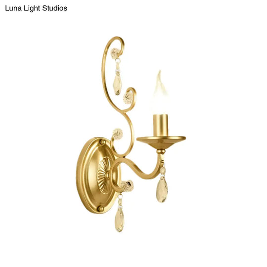 Contemporary Crystal Wall Sconce With Curved Arm And Brass Finish