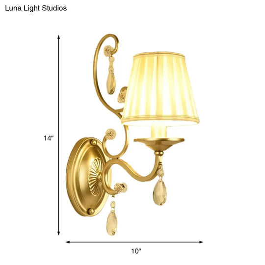 Contemporary Crystal Wall Sconce With Curved Arm And Brass Finish