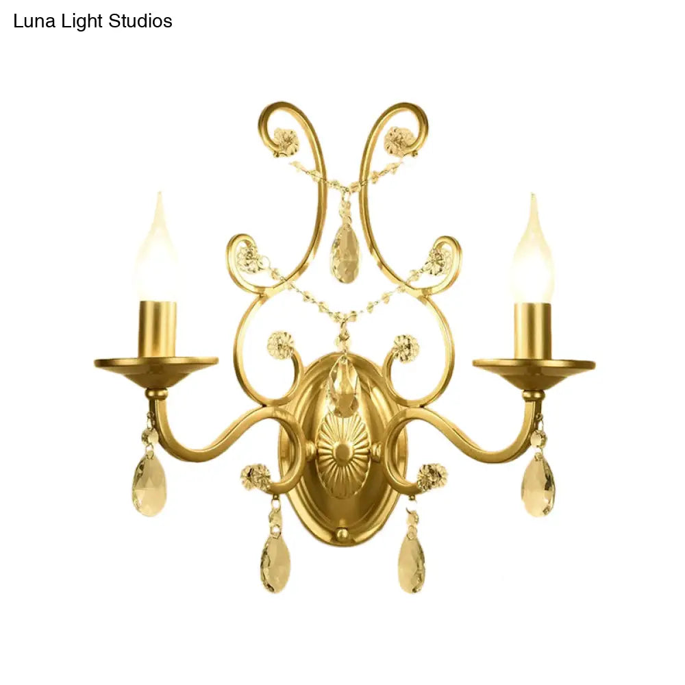 Contemporary Crystal Wall Sconce With Curved Arm And Brass Finish