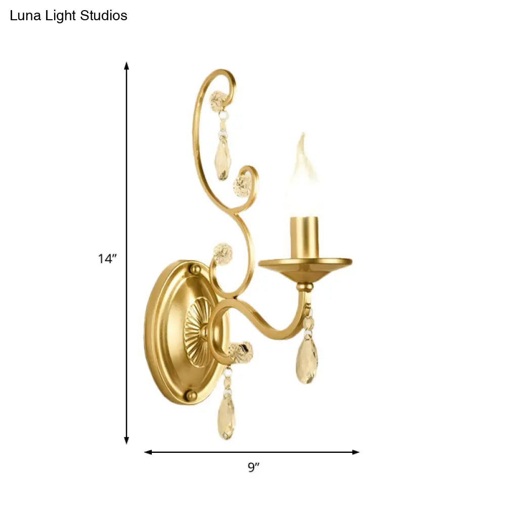 Contemporary Crystal Wall Sconce With Curved Arm And Brass Finish