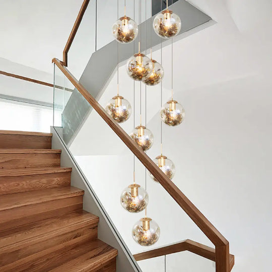 Contemporary Gold Ball Chandelier With Amber Dimpled Glass Pendant - 10 Bulbs Multi-Light For