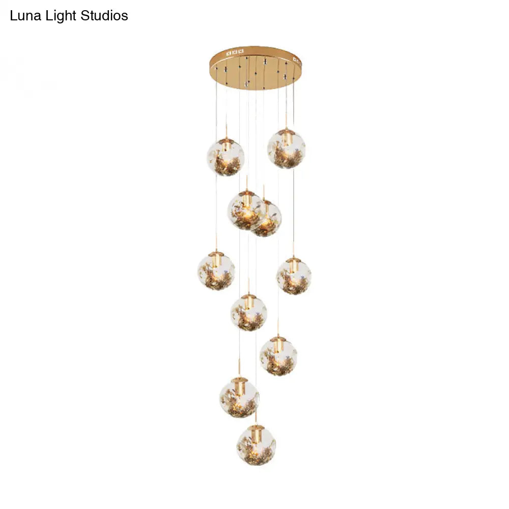 Contemporary Gold Ball Chandelier With Amber Dimpled Glass Pendant - 10 Bulbs Multi-Light For