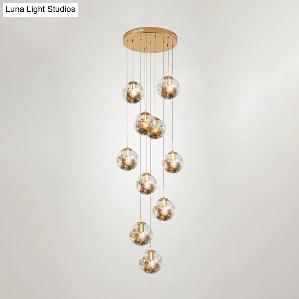 Contemporary Gold Ball Chandelier With Amber Dimpled Glass Pendant - 10 Bulbs Multi-Light For