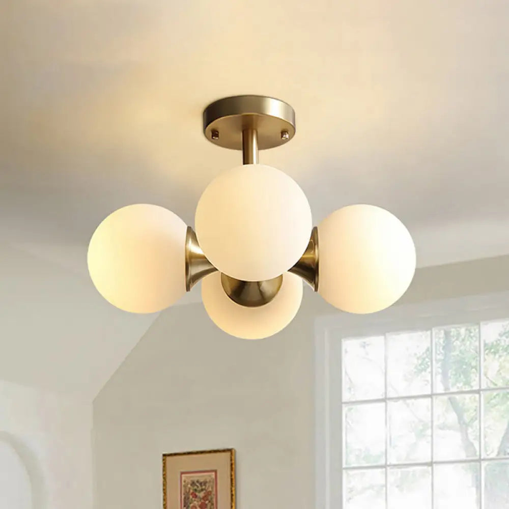 Contemporary Gold Ball Semi Flush Ceiling Light With 4 Milky Glass Heads