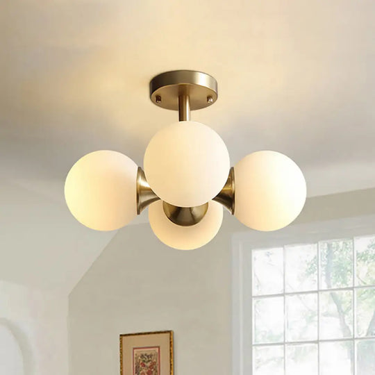 Contemporary Gold Ball Semi Flush Ceiling Light With 4 Milky Glass Heads