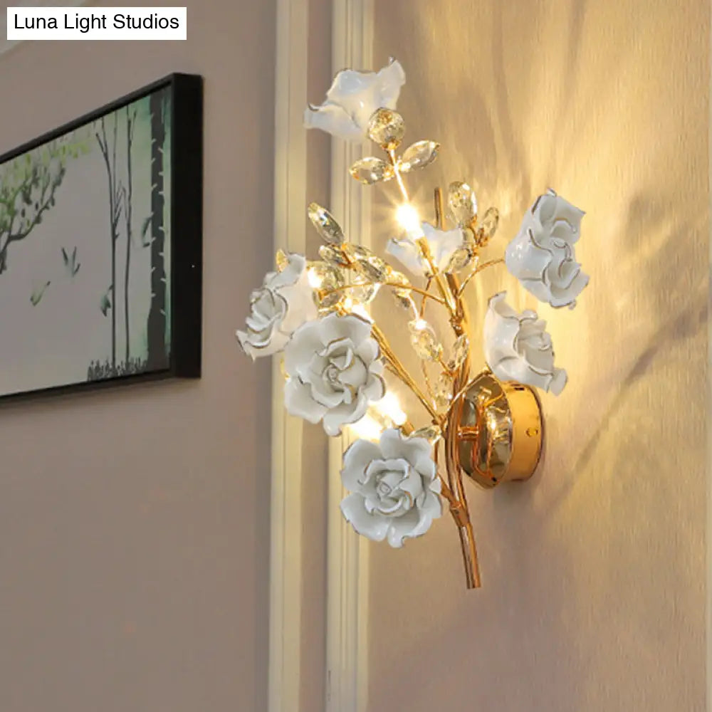 Contemporary Gold Crystal Wall Lamp With Teardrop Faceted Design And Ceramic Flower Accents - 3 Bulb