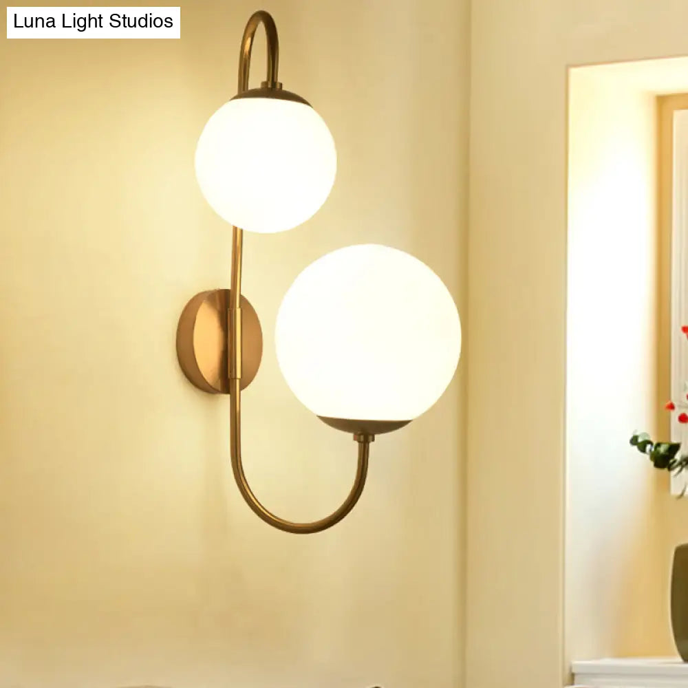 Contemporary Gold Metal Wall Sconce With Opal Glass Shade - 2 Bulb Arm Design