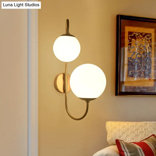 Contemporary Gold Metal Wall Sconce With Opal Glass Shade - 2 Bulb Arm Design