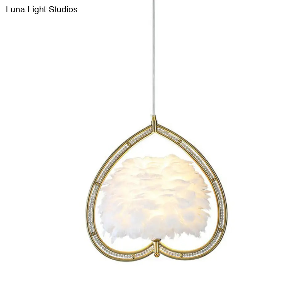 Contemporary Gold Pendant Light With Metallic Heart Suspension And Decorative Feather