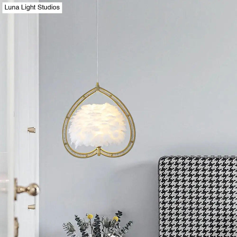 Contemporary Gold Pendant Light With Metallic Heart Suspension And Decorative Feather