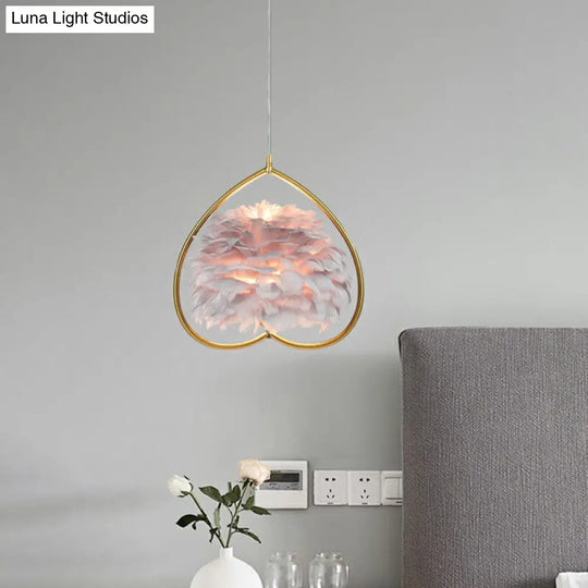 Contemporary Gold Pendant Light With Metallic Heart Suspension And Decorative Feather