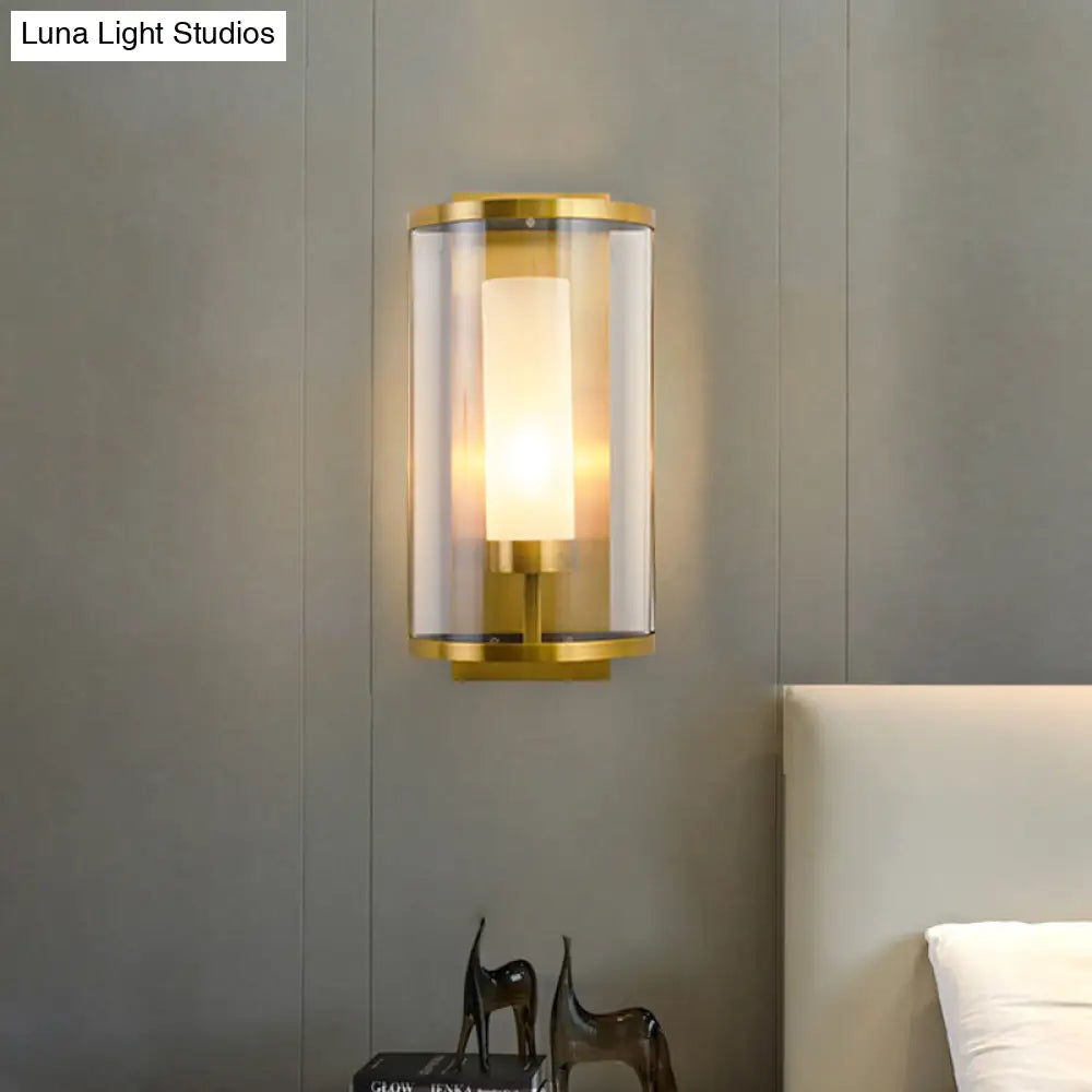 Contemporary Gold Wall Sconce With Clear Glass Shade