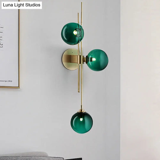 Contemporary Green/Clear Glass Globe Wall Sconce Lamp With 3 Lights In Brass