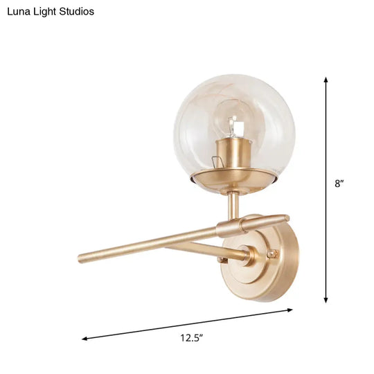 Contemporary Hand Blown Glass Wall Light With Brass Globe And Crossed Arm