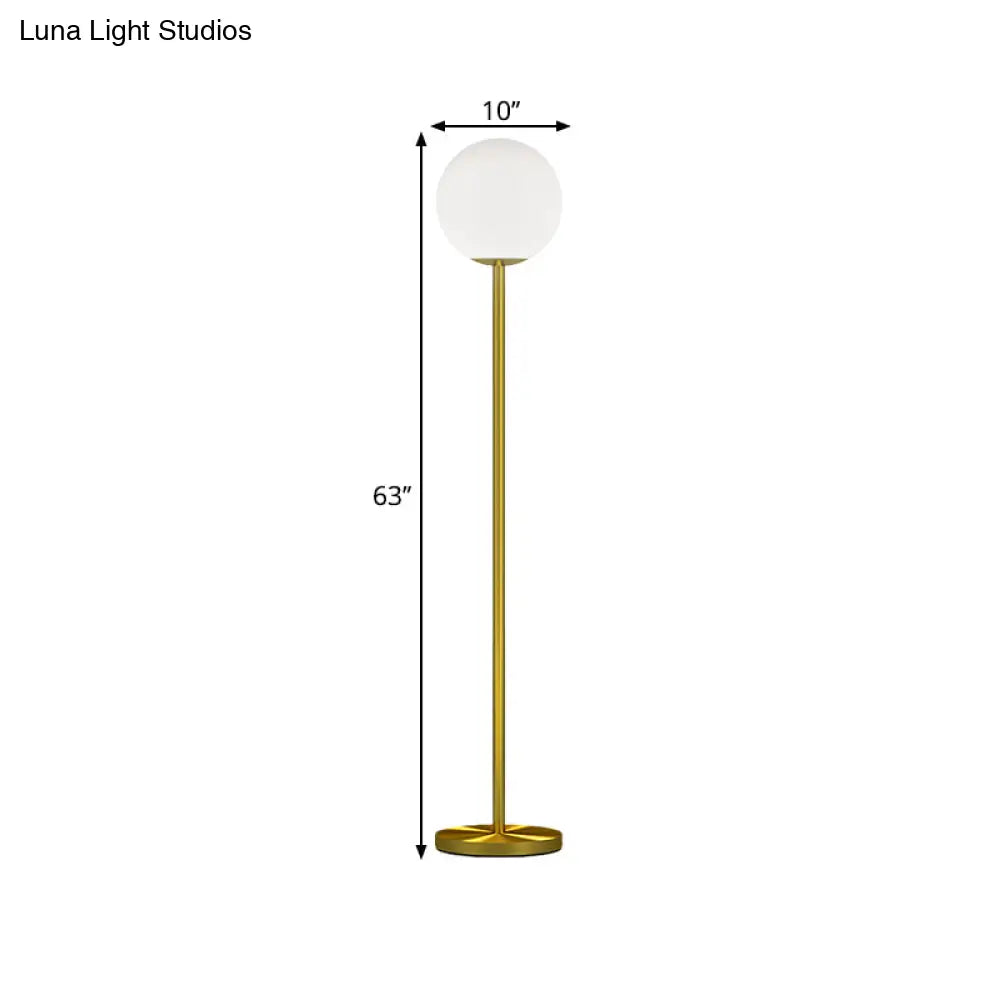 Contemporary Milky Glass Sphere Floor Light With Brass Finish - Ideal For Bedroom Reading