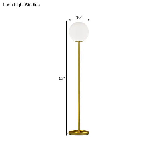 Contemporary Milky Glass Sphere Floor Light With Brass Finish - Ideal For Bedroom Reading