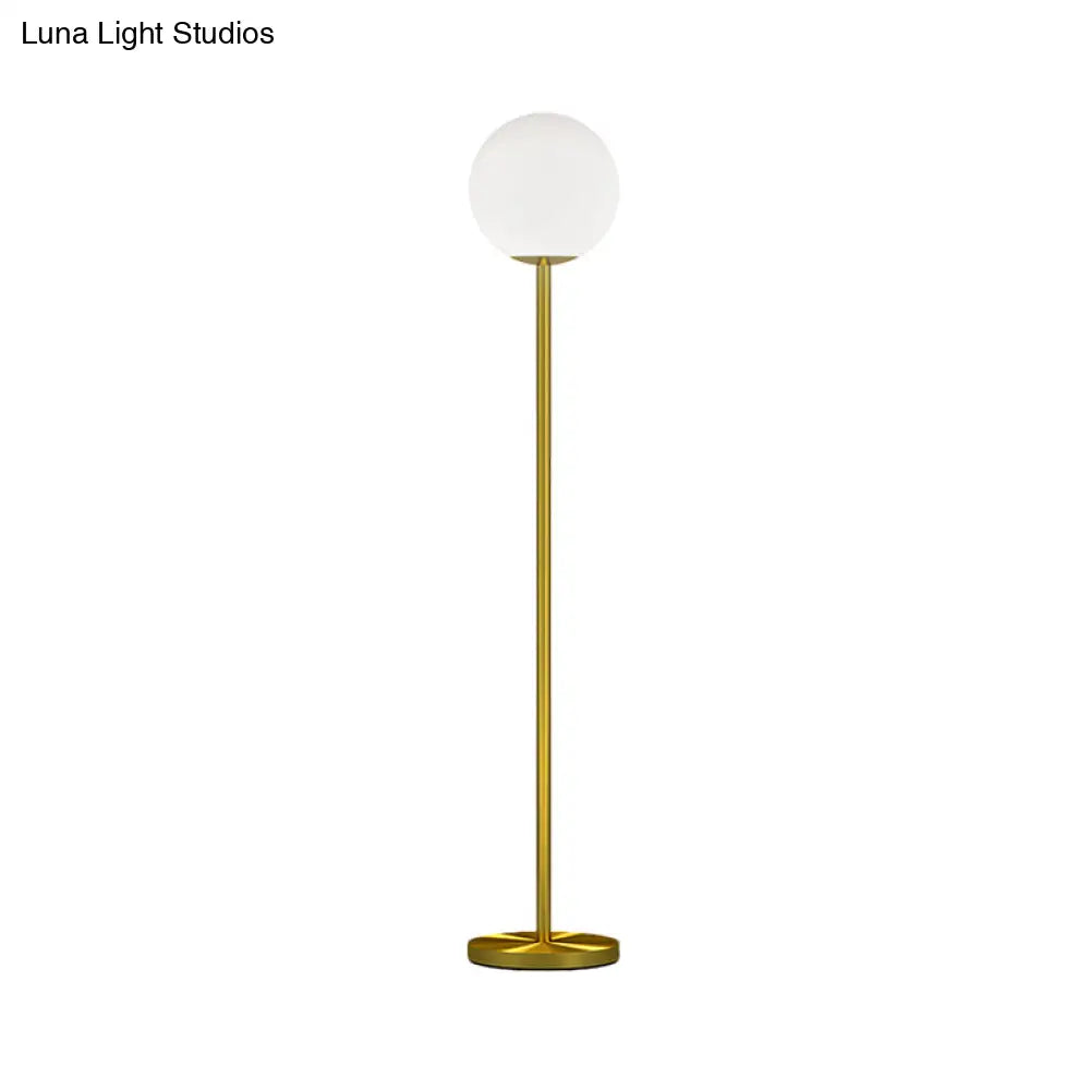 Contemporary Milky Glass Sphere Floor Light With Brass Finish - Ideal For Bedroom Reading