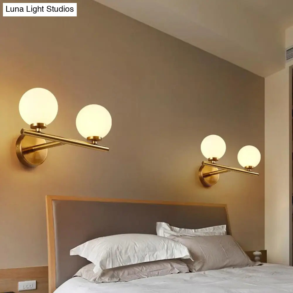 Contemporary White Glass Bedside Wall Light In Gold - Spherical Lighting Fixture