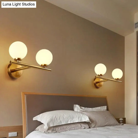 Contemporary White Glass Bedside Wall Light In Gold - Spherical Lighting Fixture