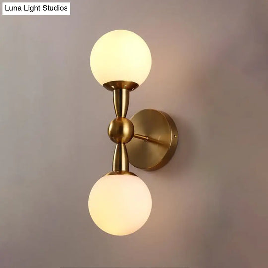 Contemporary White Glass Bedside Wall Light In Gold - Spherical Lighting Fixture