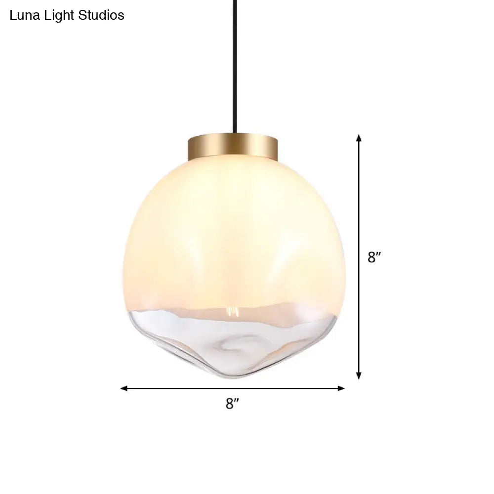 Modern Globe Pendant Light With Dimpled Glass In White And Clear Brass Finish