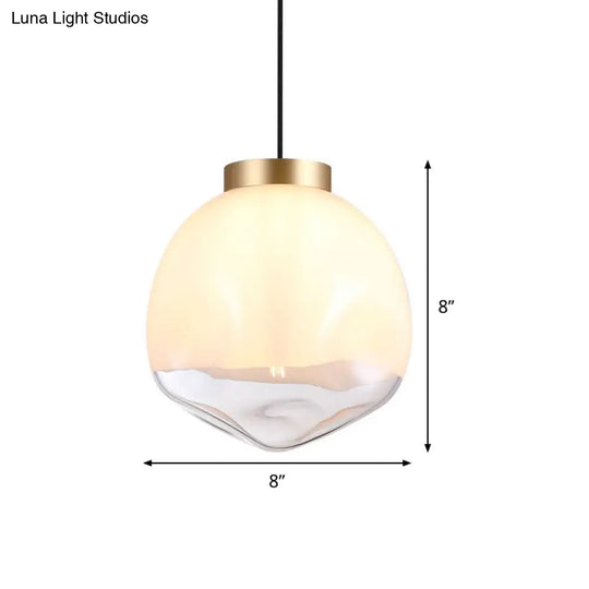 Modern Globe Pendant Light With Dimpled Glass In White And Clear Brass Finish