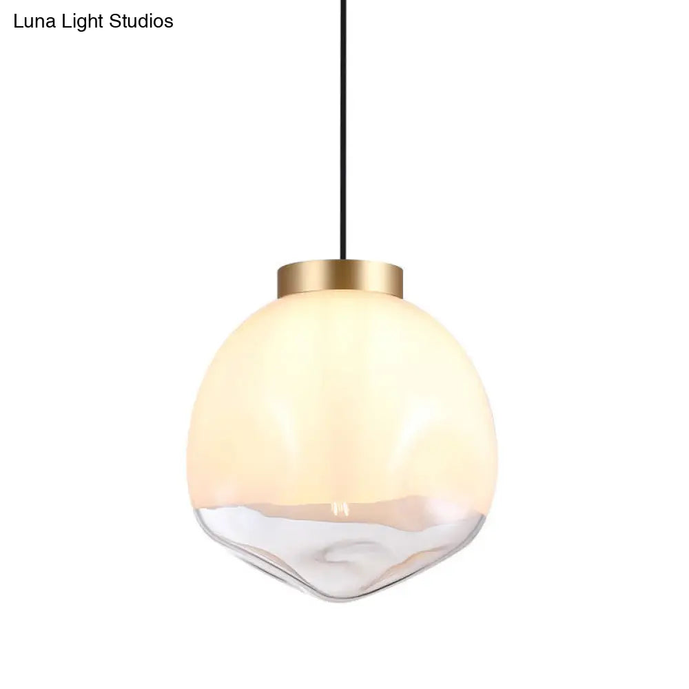 Modern Globe Pendant Light With Dimpled Glass In White And Clear Brass Finish