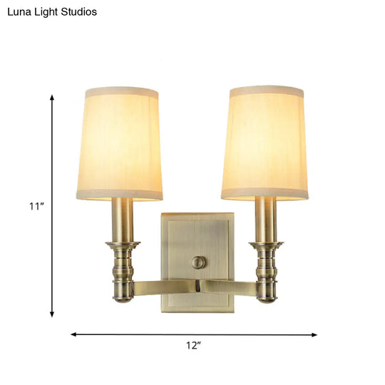 Country Corridor Wall Light Fixture With Brass Frame And Cylinder Fabric Shade