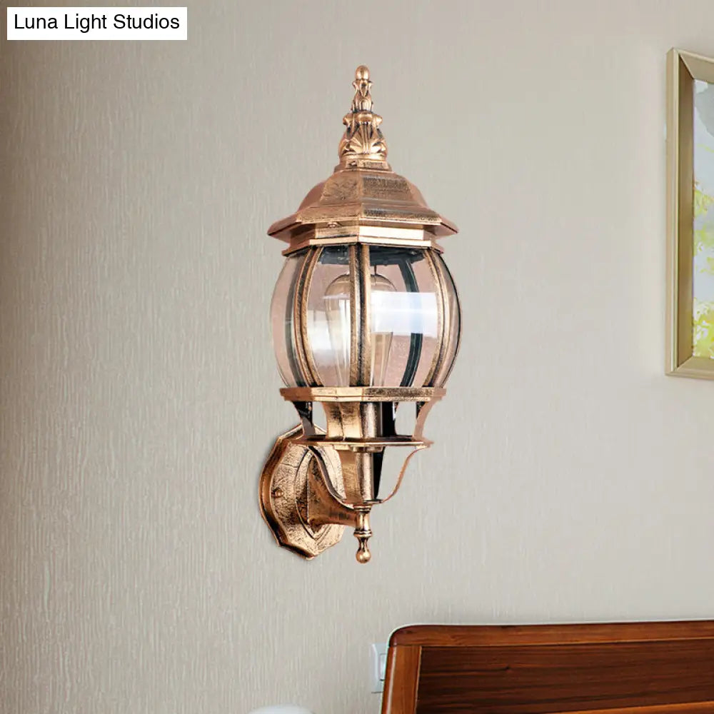 Country Outdoor Wall Light With Clear Glass Shade In Brass - 1 Bulb Fixture