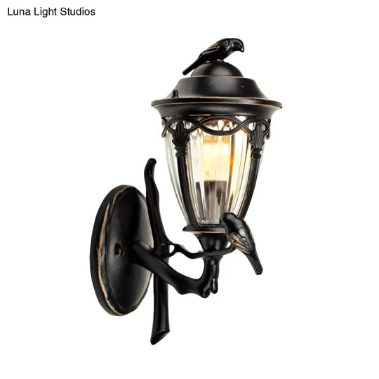 Countryside 1-Light Black Clear Glass Urn Wall Sconce With Bird Decor Perfect For Patio Lighting