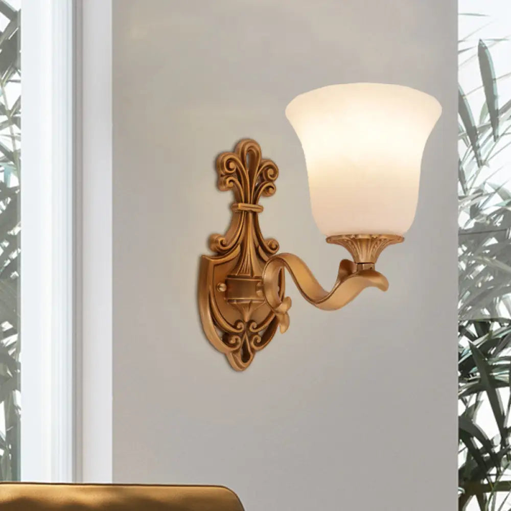 Countryside Opal Glass Wall Sconce With Brass Finish And Curvy Arm