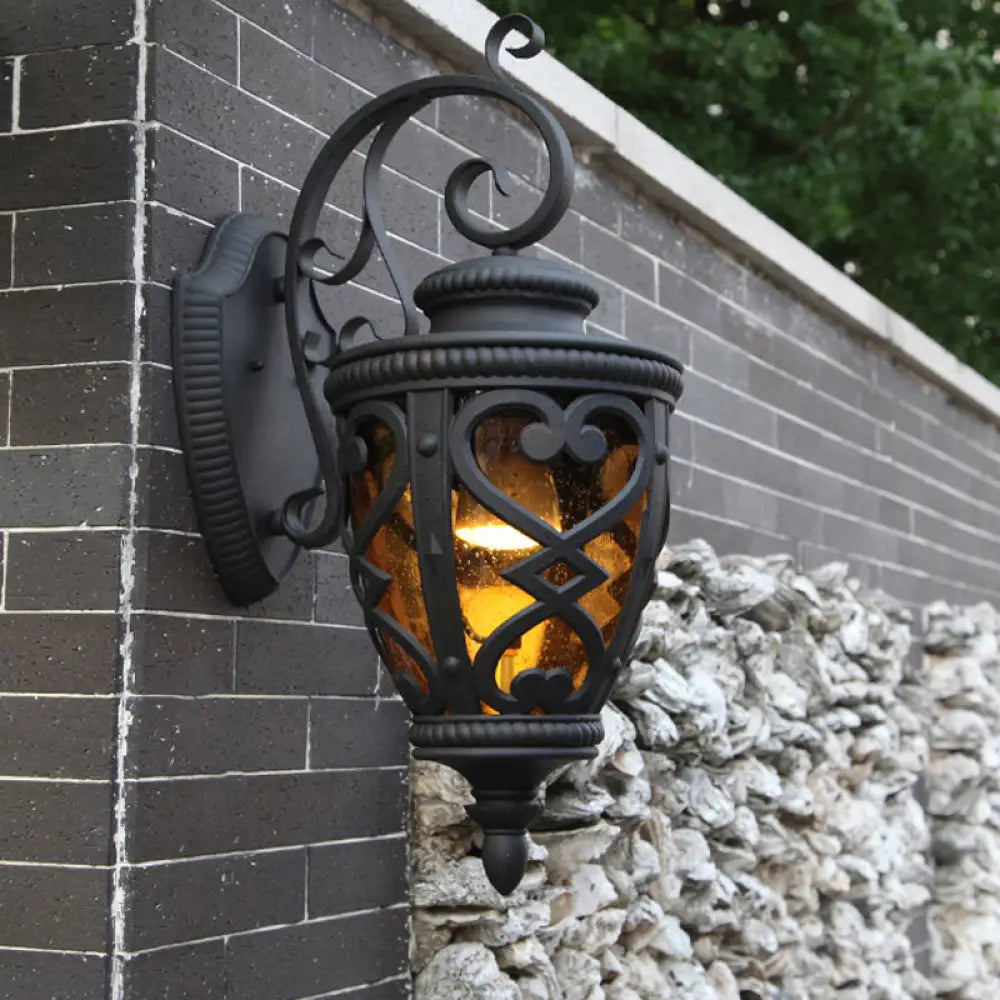 Courtyard Wall Light Fixture: Elegant Urn Shape One Amber Glass Black Mount