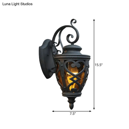 Courtyard Wall Light Fixture: Elegant Urn Shape One Amber Glass Black Mount