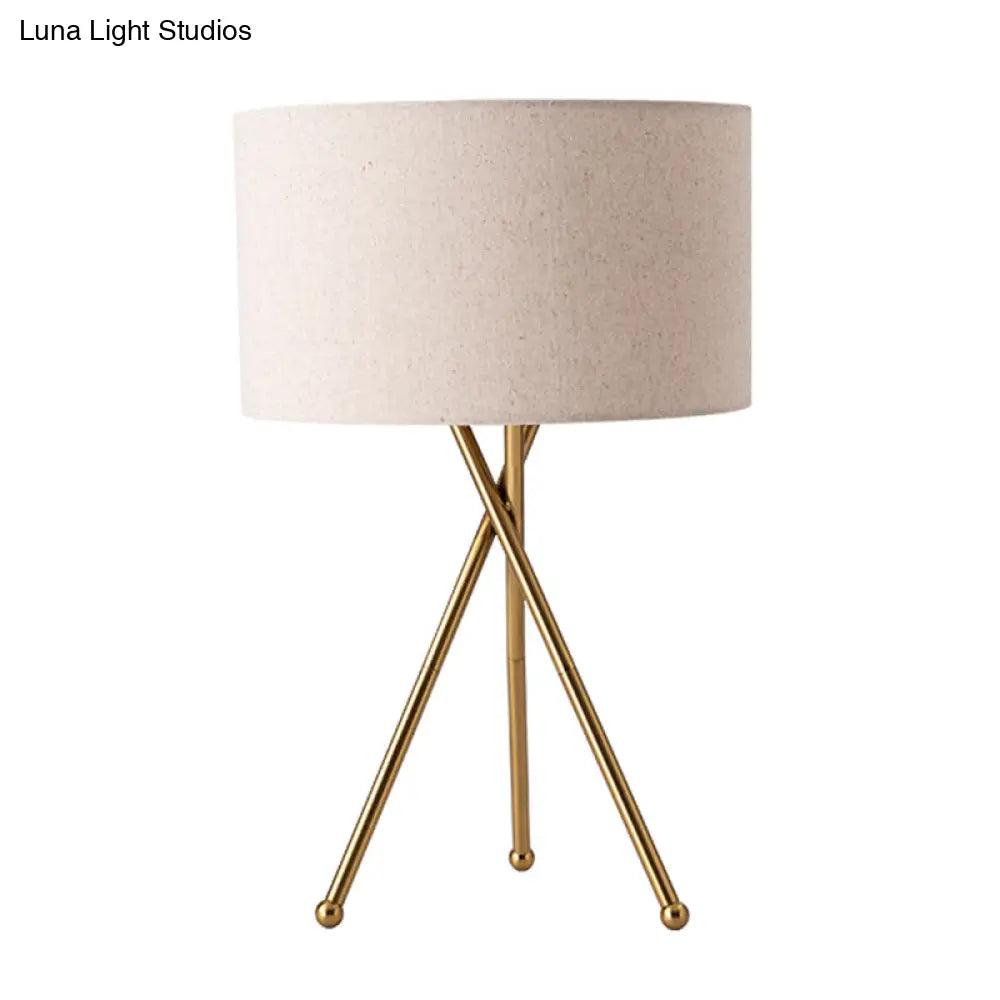 Drum Shaped Table Lamp With Metallic Tripod: Artistic Nightstand Light