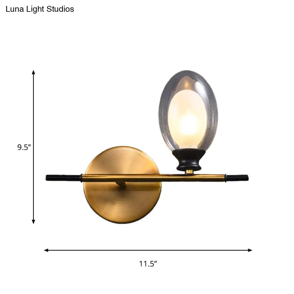 Elegant Clear/Amber Glass Egg Shape Wall Light - Minimalist 1 Brass Sconce