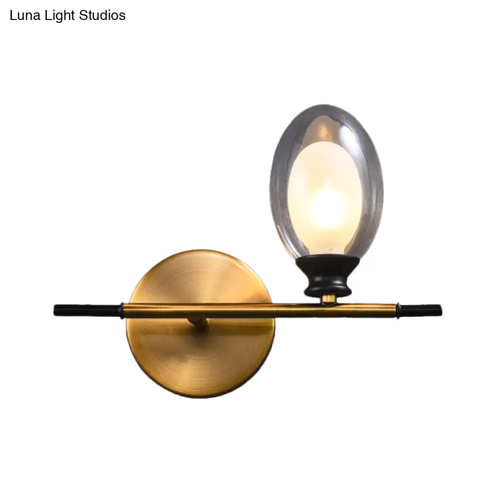 Elegant Clear/Amber Glass Egg Shape Wall Light - Minimalist 1 Brass Sconce