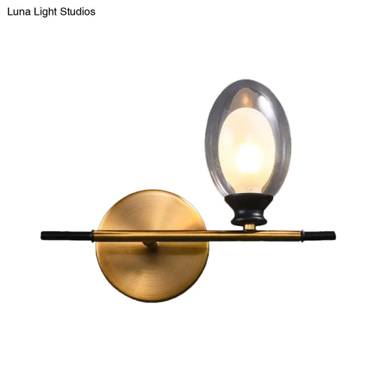 Elegant Clear/Amber Glass Egg Shape Wall Light - Minimalist 1 Brass Sconce