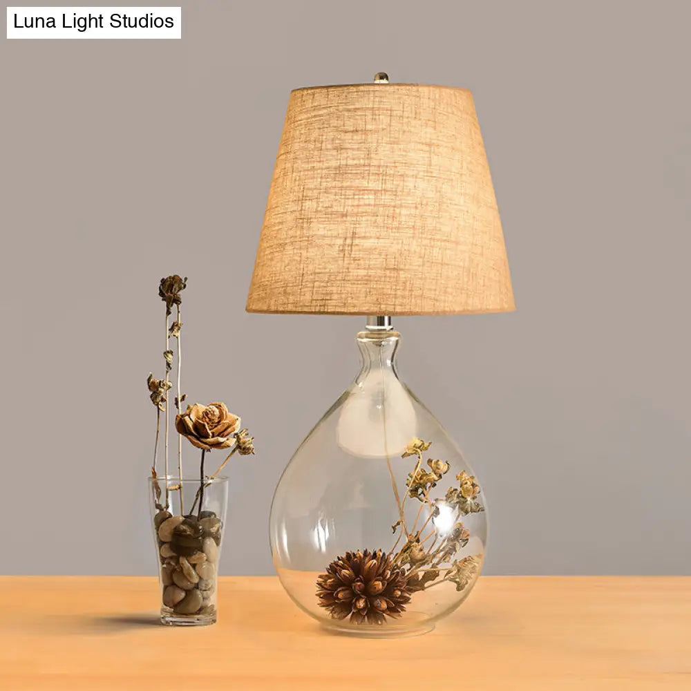 Contemporary Clear Waterdrop Glass Table Lamp With Floral Decor And Fabric Shade