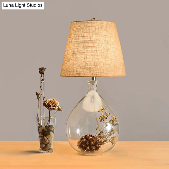 Contemporary Clear Waterdrop Glass Table Lamp With Floral Decor And Fabric Shade