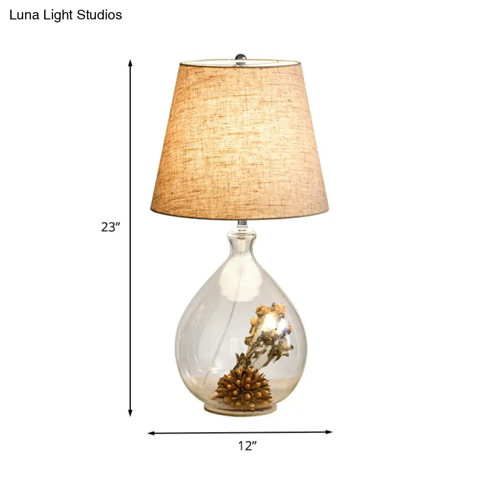 Contemporary Clear Waterdrop Glass Table Lamp With Floral Decor And Fabric Shade