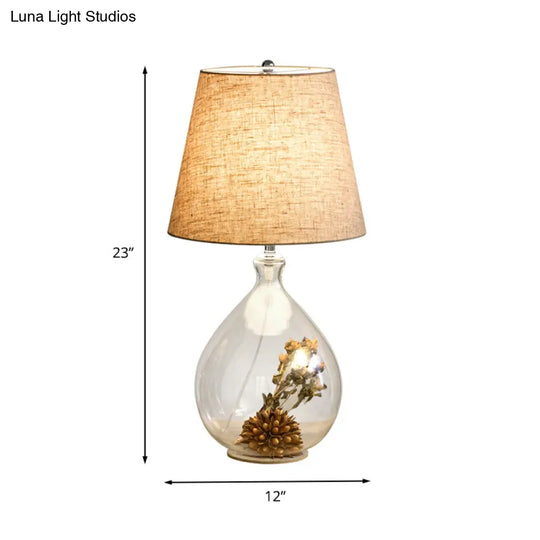 Contemporary Clear Waterdrop Glass Table Lamp With Floral Decor And Fabric Shade