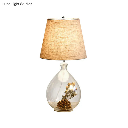 Contemporary Clear Waterdrop Glass Table Lamp With Floral Decor And Fabric Shade