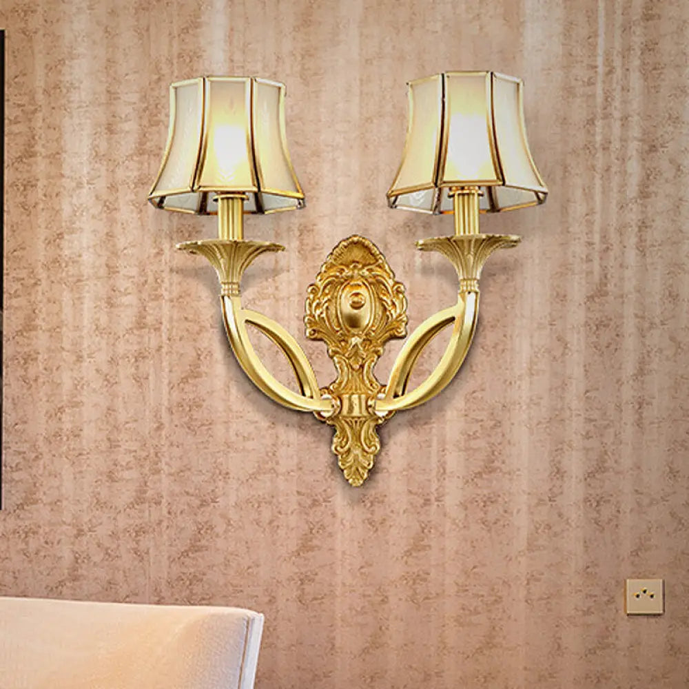 Frosted Glass Wall Sconce With Brass Paneled Bell And Scrolled Arm For Traditional Living Room Décor