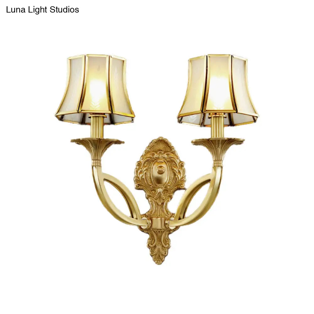 Frosted Glass Wall Sconce With Brass Paneled Bell And Scrolled Arm For Traditional Living Room Décor