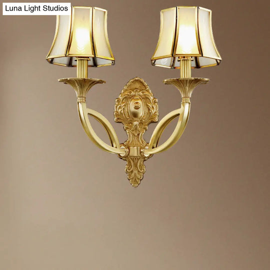 Frosted Glass Wall Sconce With Brass Paneled Bell And Scrolled Arm For Traditional Living Room Décor